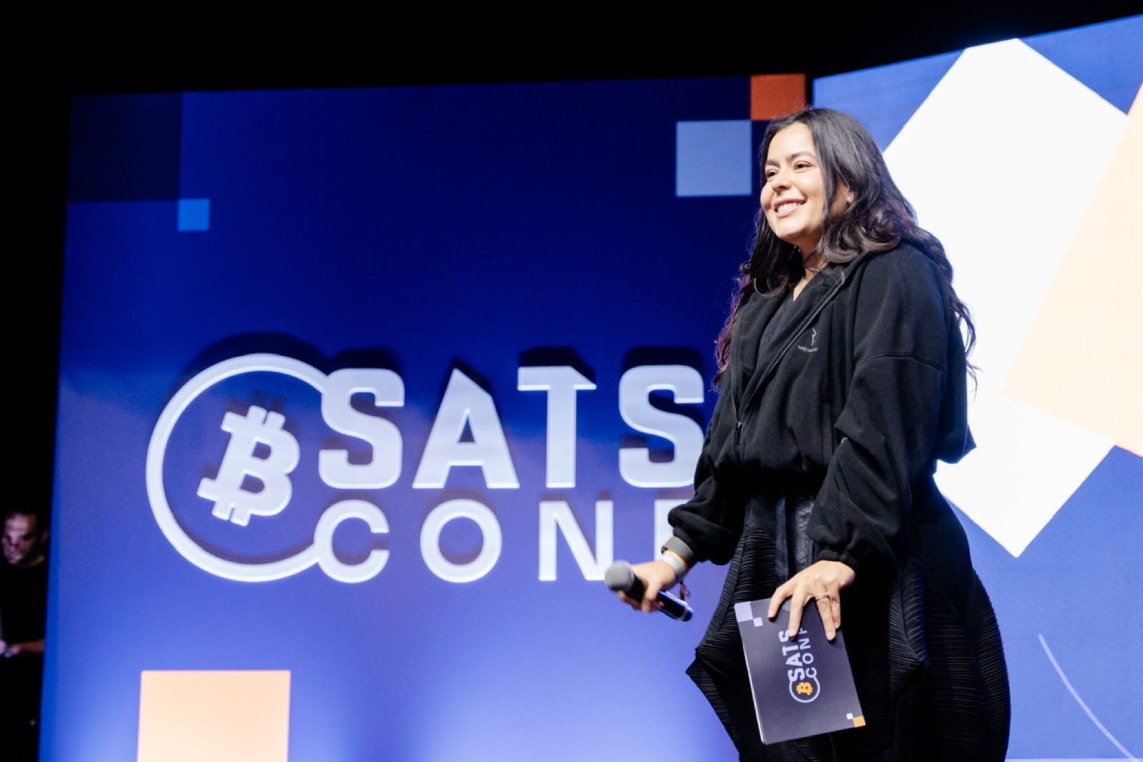 Ivy presenting on stage at Satsconf
