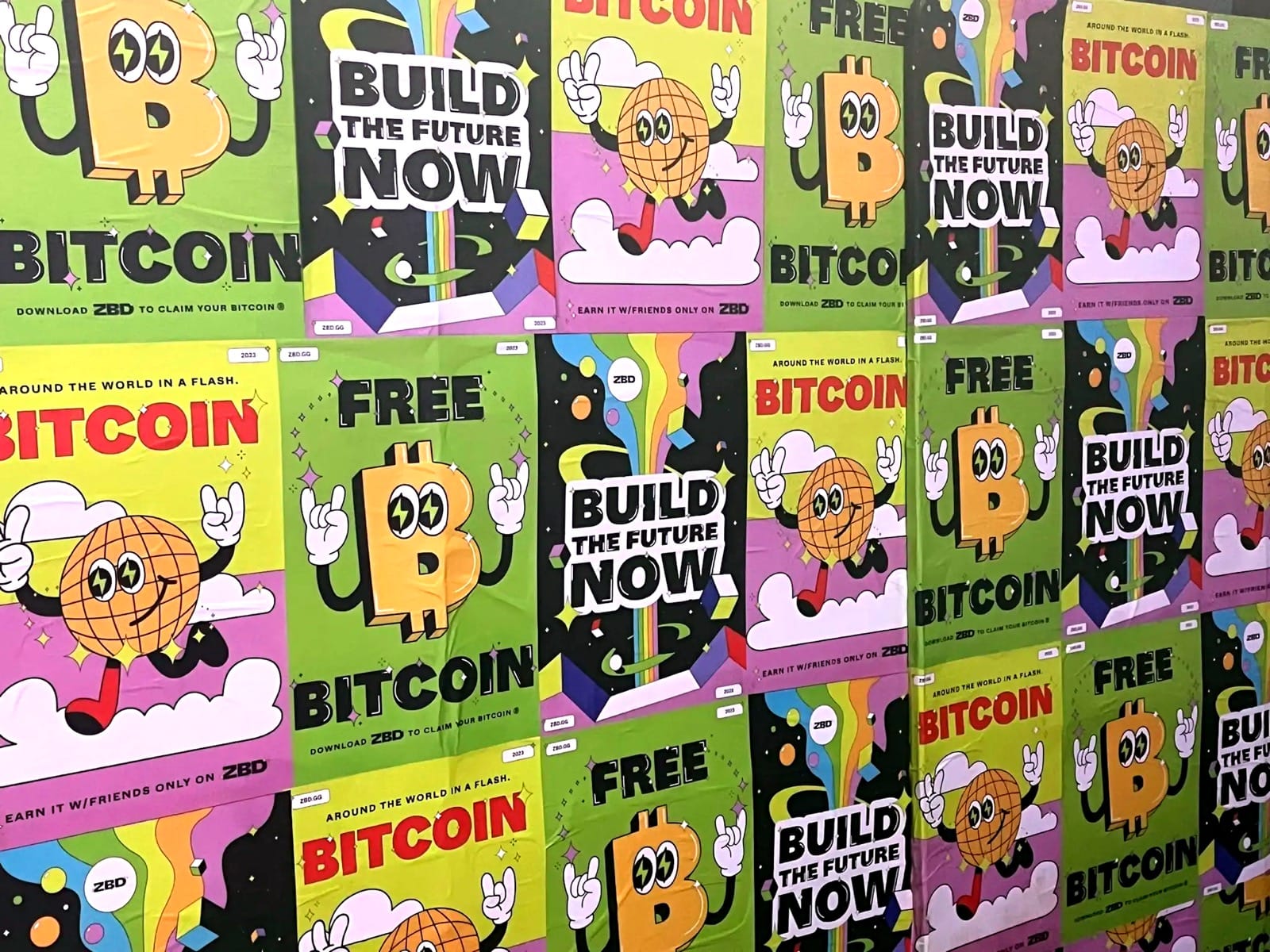 Wall covered with colorful ZBD bitcoin campaign posters